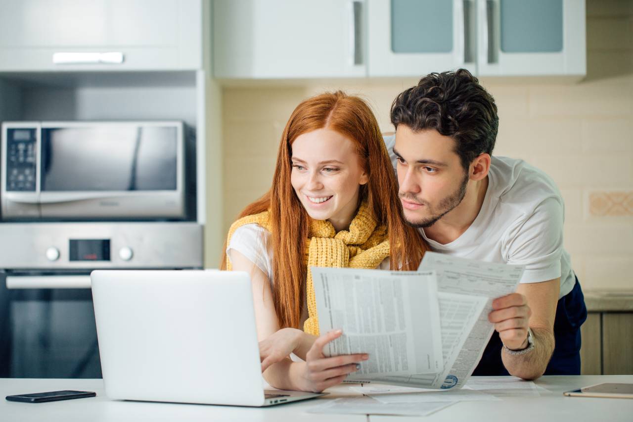 A couple saving money with their flat-fee financial planner